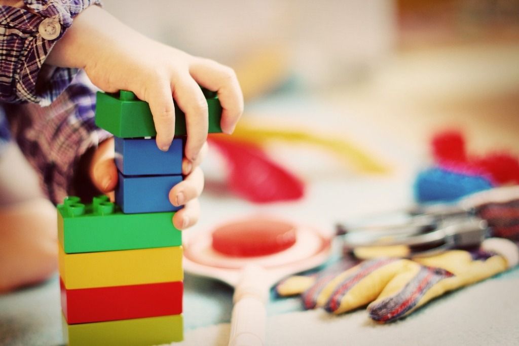 Child building tower motor skills