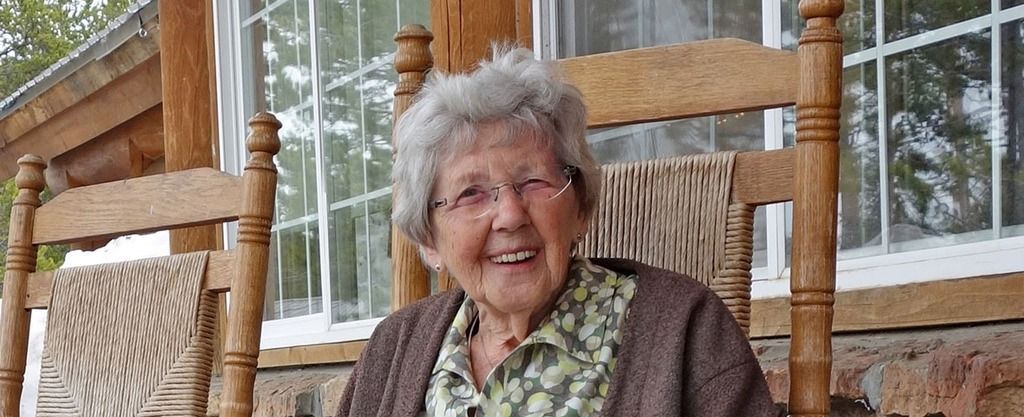 Elderly woman on porch