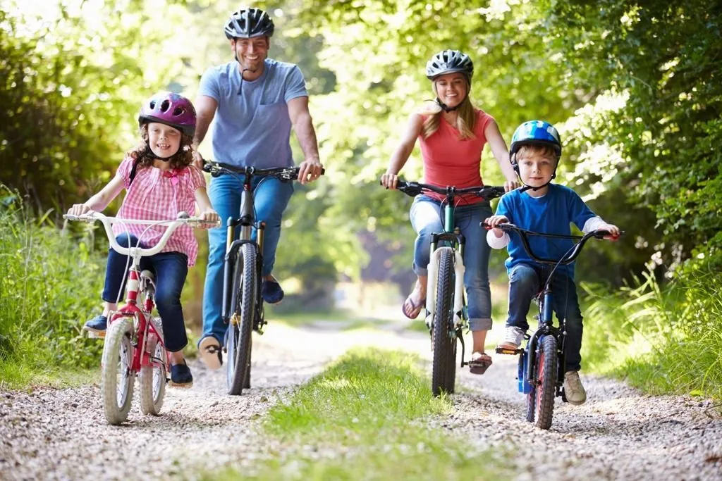 Family biking in forest