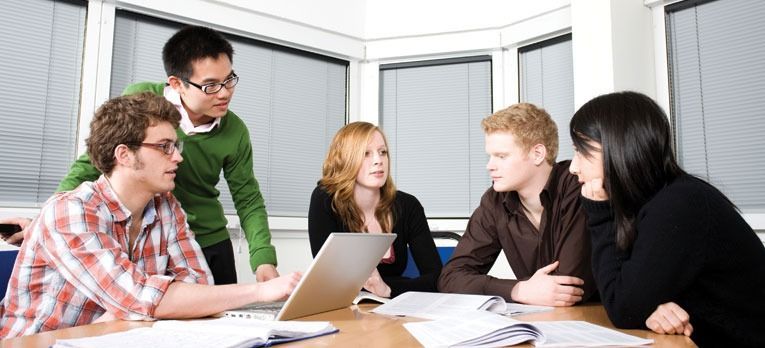 Group students with laptop meeting