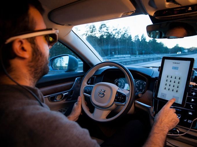 Man in a car doing some research