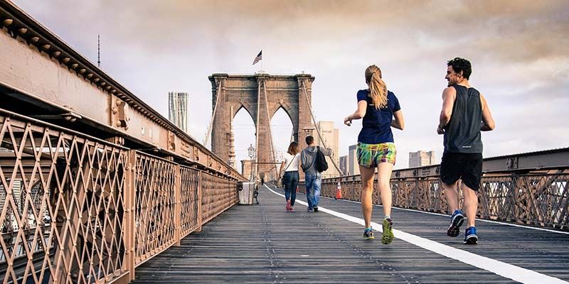 Running on a bridge man and woman