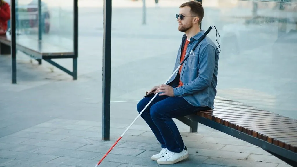 blind-male-at-busstop