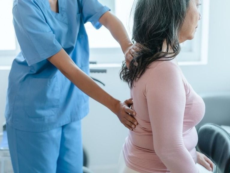 Pain doctor examining a patient