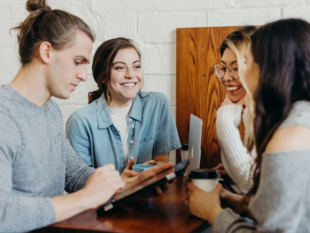 People discussing and drinking coffee