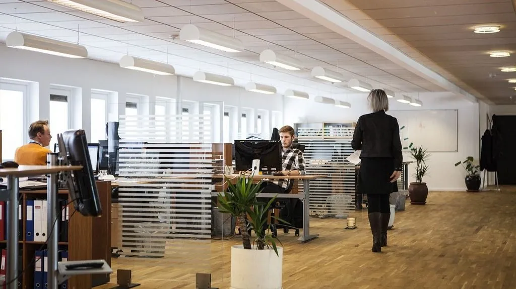 office-floor-desk-open-space-woman-walking